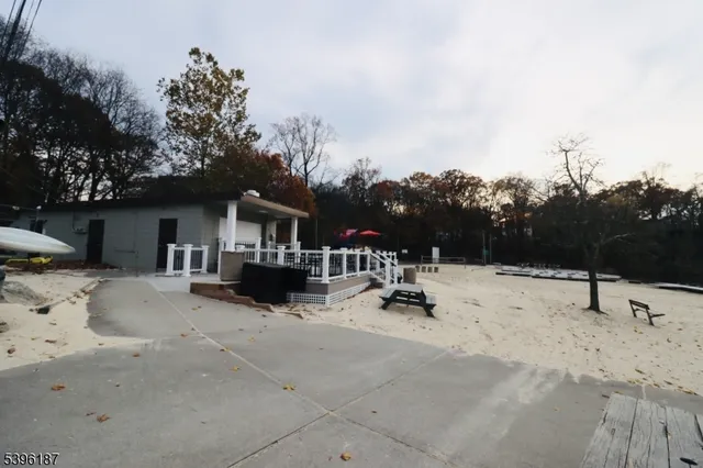 a view of a house with a snow on the road