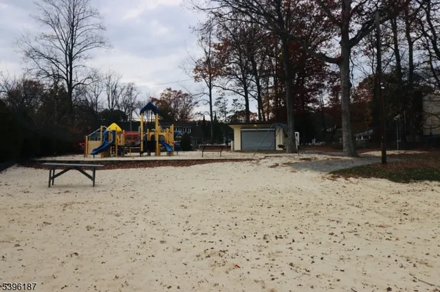 a view of outdoor space with lots of trees in the background