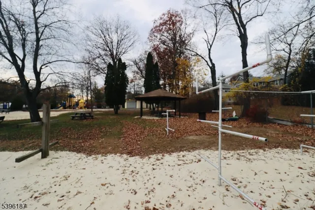 a view of a lake with houses in the back