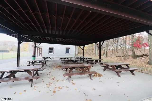 a view of a pathway with a wrought fence