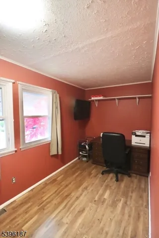 a room with a bed and window