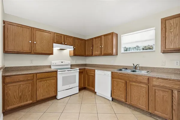 a kitchen with a sink and cabinets