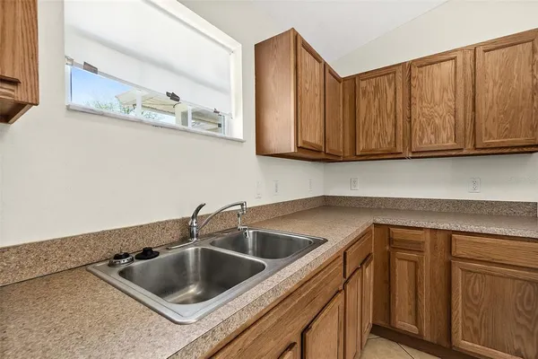 a kitchen with cabinets a sink and dishwasher