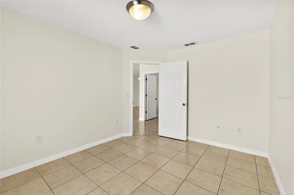 an empty room with wooden floor