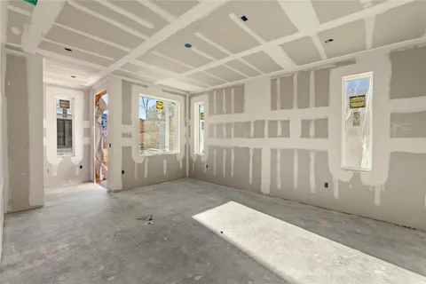 a view of a big room with windows