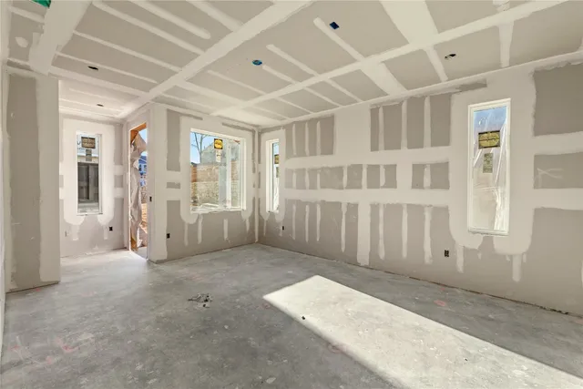 a view of a big room with windows