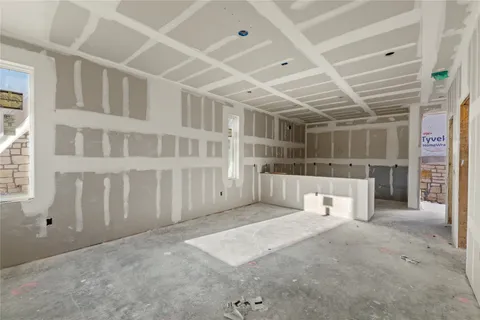 a view of an empty room with a garage