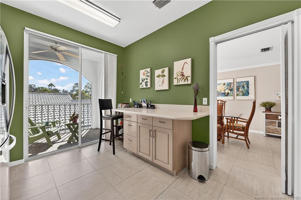 12392 Harbour Ridge Boulevard, Unit 54 Palm City, FL 34990 - Photo 13 of 35 a spacious bathroom with a double vanity sink and a mirror