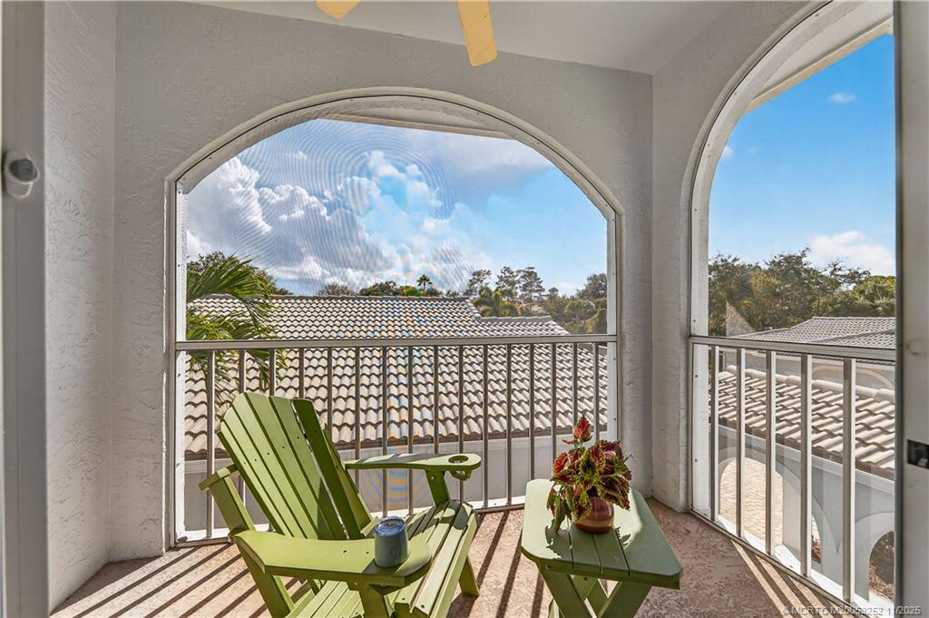 12392 Harbour Ridge Boulevard, Unit 54 Palm City, FL 34990 - Photo 14 of 35 a view of a balcony with furniture