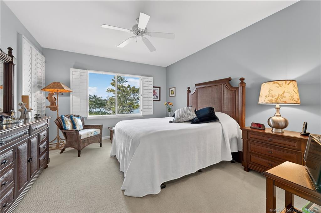 12392 Harbour Ridge Boulevard, Unit 54 Palm City, FL 34990 - Photo 15 of 35 a bedroom with a bed and window