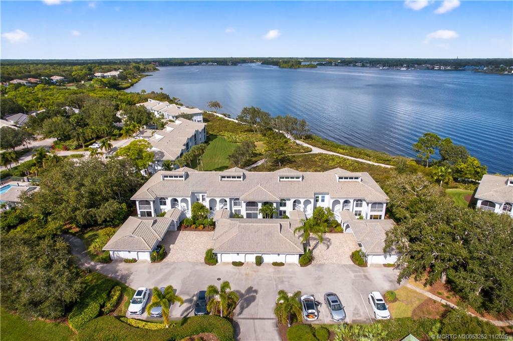 12392 Harbour Ridge Boulevard, Unit 54 Palm City, FL 34990 - Photo 25 of 35 an aerial view of house with yard swimming pool and outdoor seating