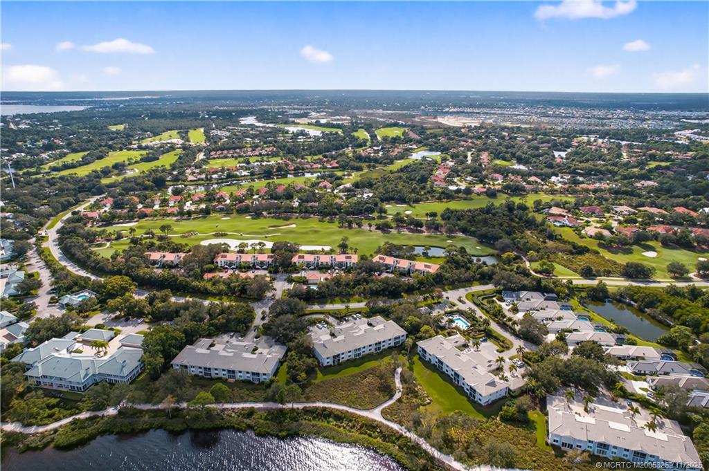 12392 Harbour Ridge Boulevard, Unit 54 Palm City, FL 34990 - Photo 32 of 35 an aerial view of residential houses with outdoor space