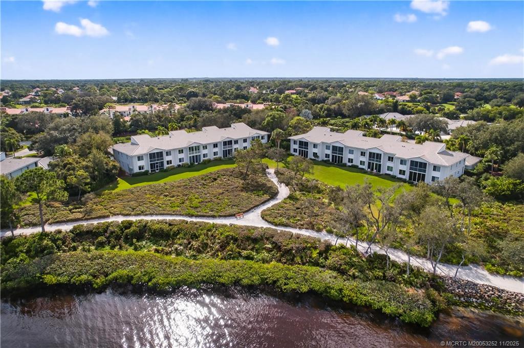12392 Harbour Ridge Boulevard, Unit 54 Palm City, FL 34990 - Photo 34 of 35 a view of a city with mountains in the background