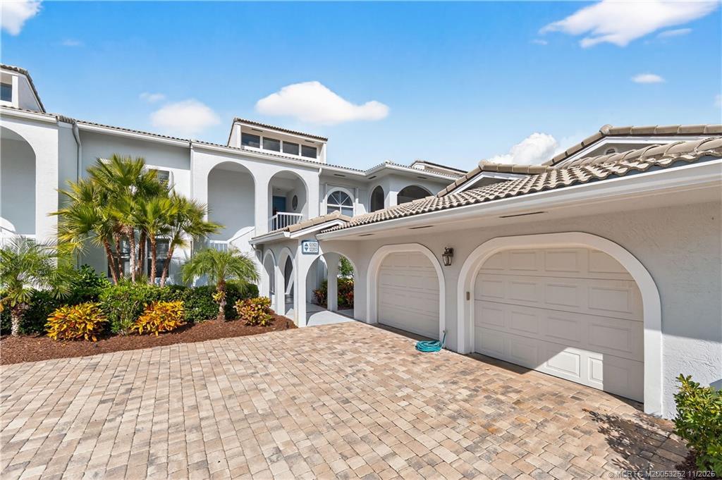 12392 Harbour Ridge Boulevard, Unit 54 Palm City, FL 34990 - Photo 35 of 35 a front view of a house with a porch