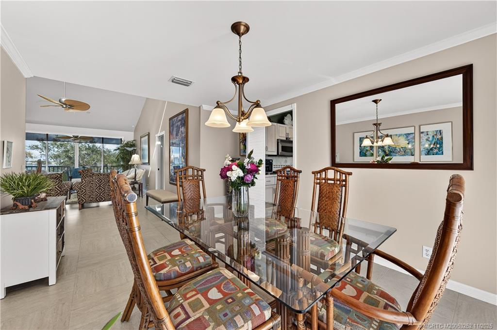 12392 Harbour Ridge Boulevard, Unit 54 Palm City, FL 34990 - Photo 10 of 35 a view of a dining room with furniture window and wooden floor