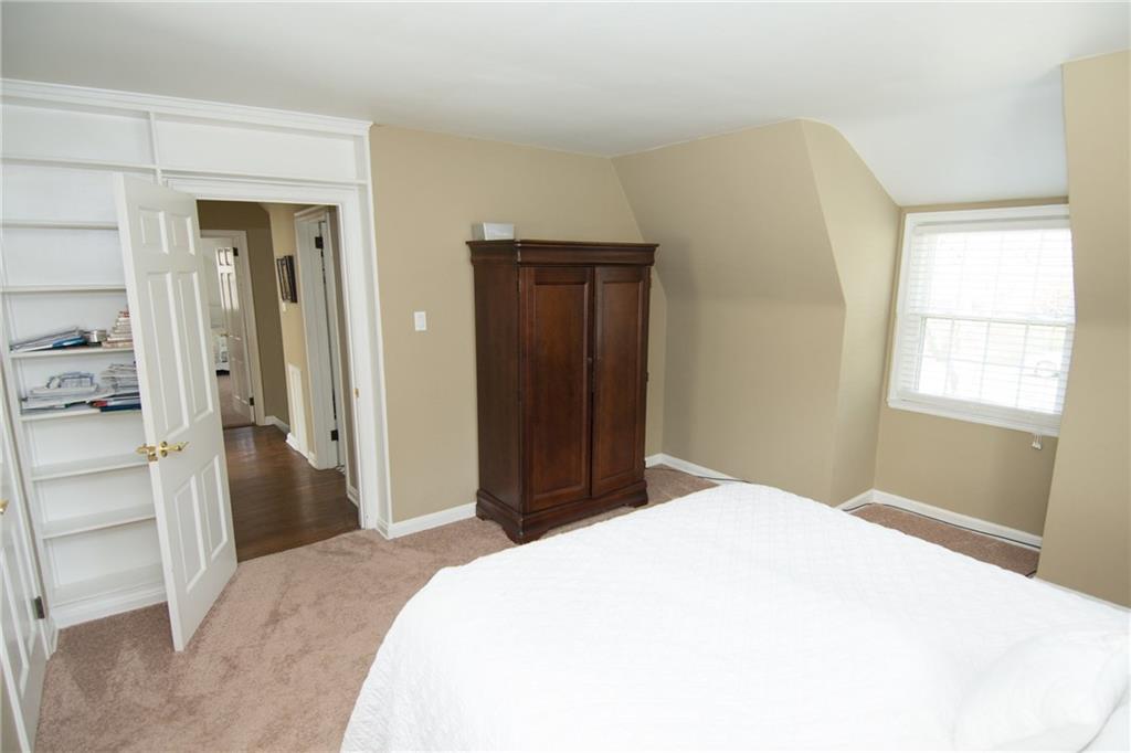 4917 Baptist Road Whitehall, PA 15227 - Photo 11 of 25 An alternate view of the master bedroom. Note the built in bookcase surrounding the six panel door as well as the additional space for plenty of furniture.