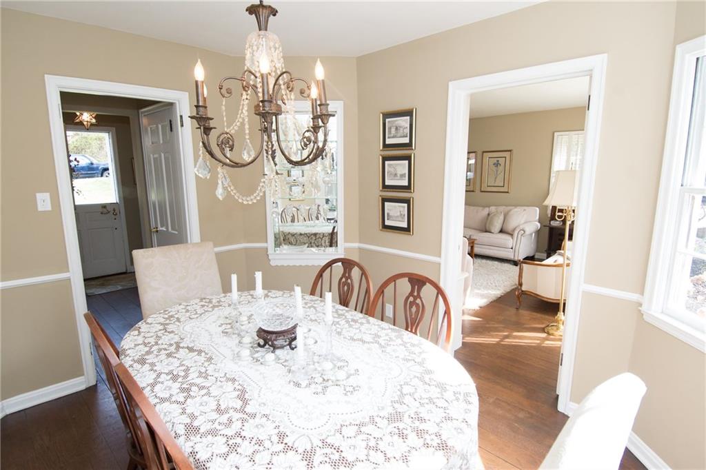 4917 Baptist Road Whitehall, PA 15227 - Photo 3 of 25 The entry offers a coat closet and a view of this beautiful curved dining room with built in glass and mirrored shelving.