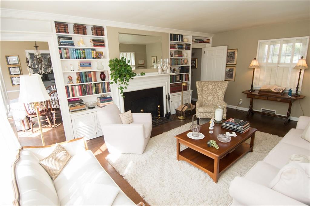 4917 Baptist Road Whitehall, PA 15227 - Photo 6 of 25 The living room offers two other windows as well--- complete with plantation shutters. One can be seen in this photo and the other is on the wall opposite the fireplace. Plenty of space to relax and unwind or to entertain!