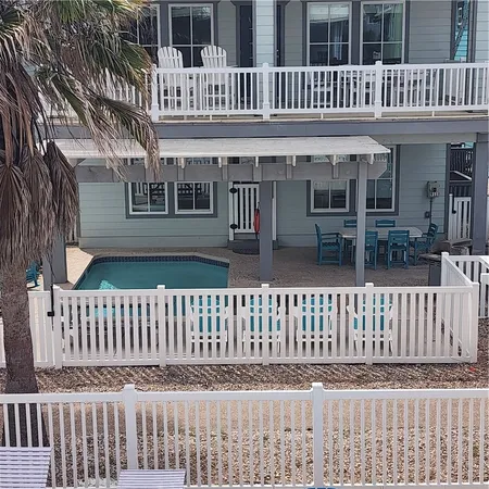 a view of a house with a small deck