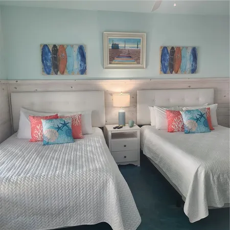 a bedroom with a bed and wall painting