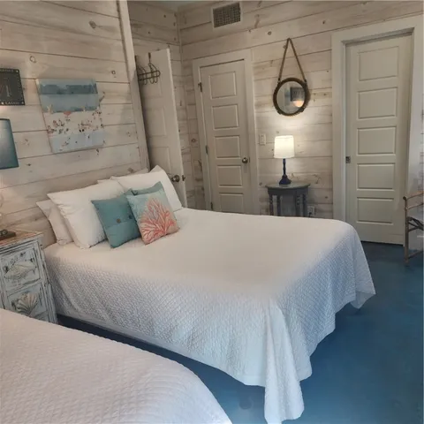 a bathroom with a sink a light fixture and a toilet