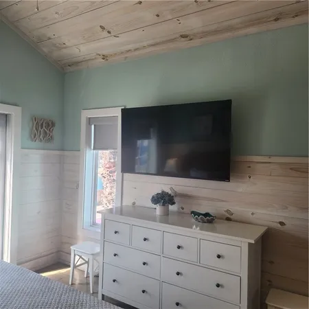 a bathroom with a sink a light fixture and a toilet