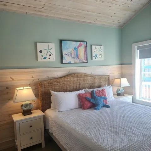 a view of a porch with furniture and floor to ceiling window