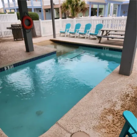 swimming pool view with a lake view