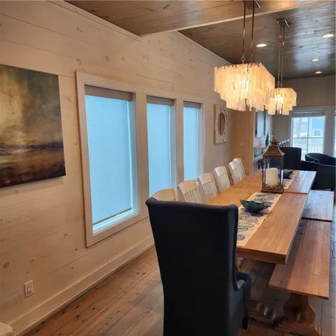 a living room with dining table and chairs