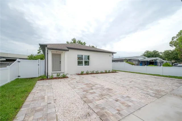 a view of a house with a yard and garage