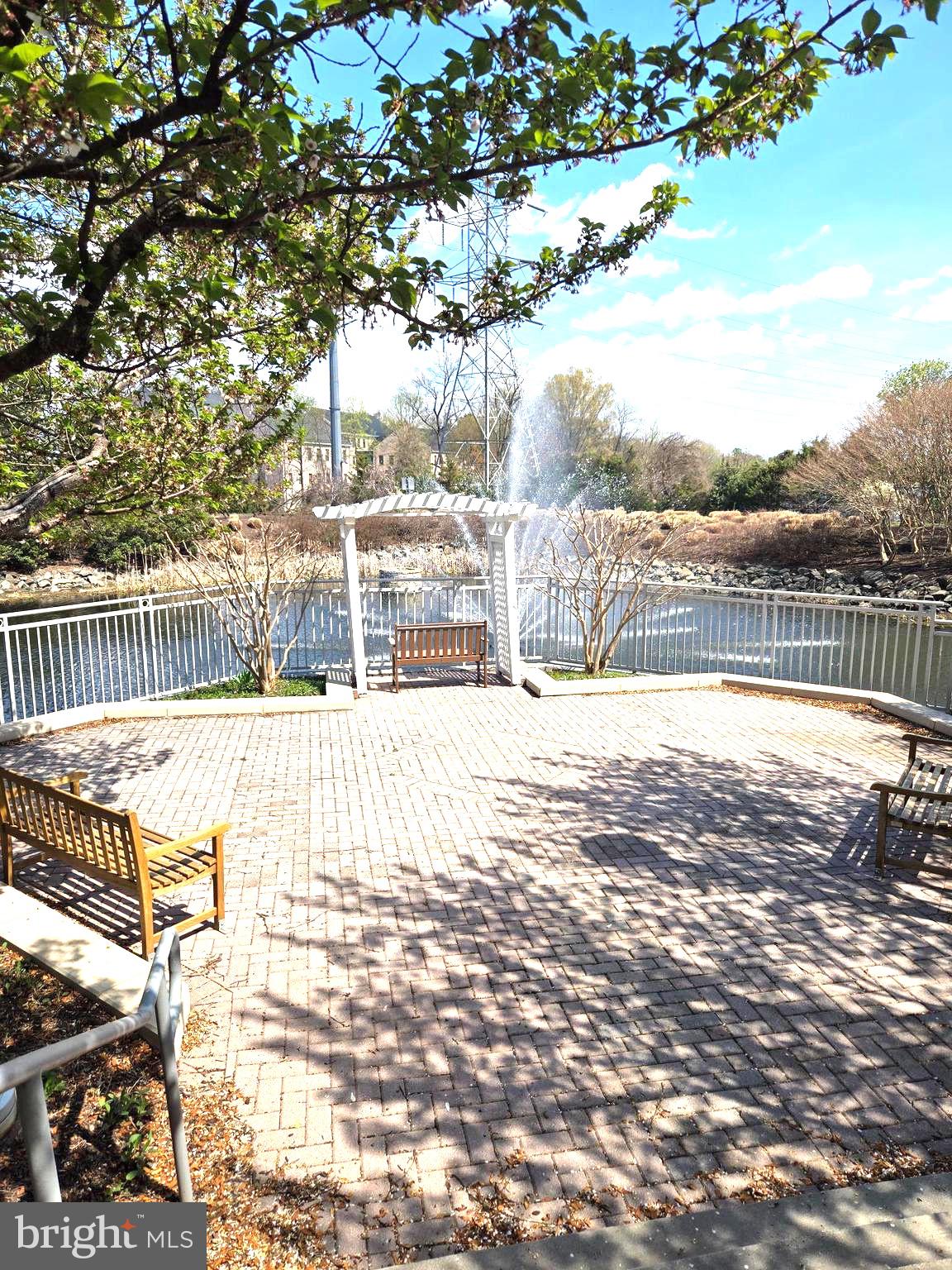 11800 Sunset Hills Road, Unit 509 Reston, VA 20190 - Photo 3 of 37 Relax by the pond in the front entrance of condo