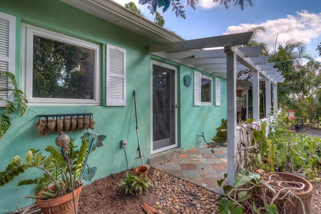 9144 7th Street North Naples, FL 34108 - Photo 15 of 20 a front view of a house