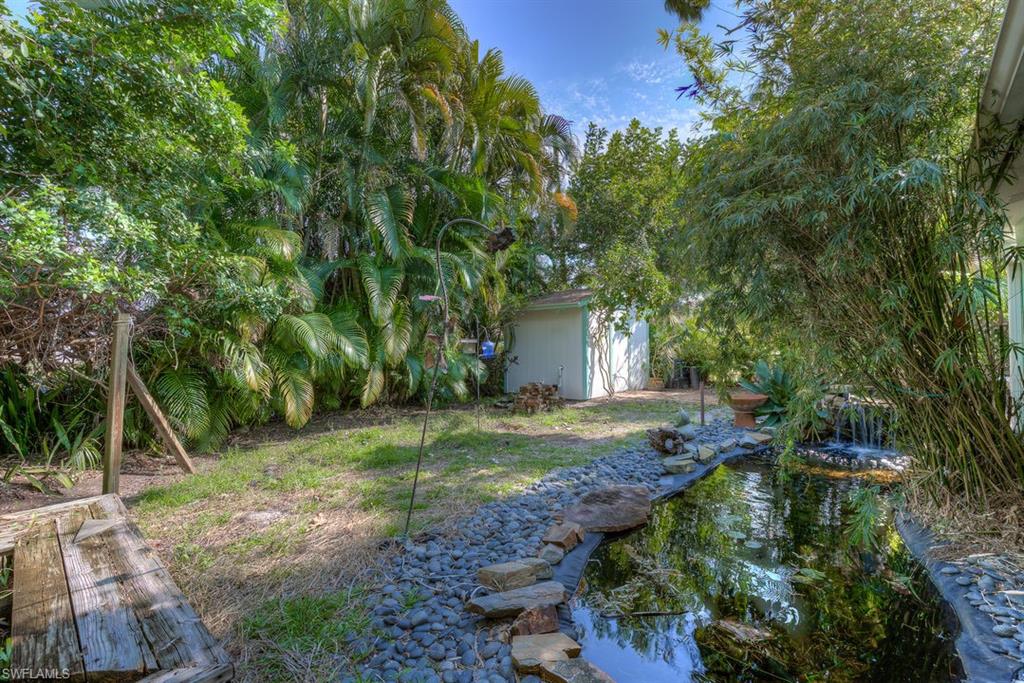 9144 7th Street North Naples, FL 34108 - Photo 19 of 20 a view of backyard with green space