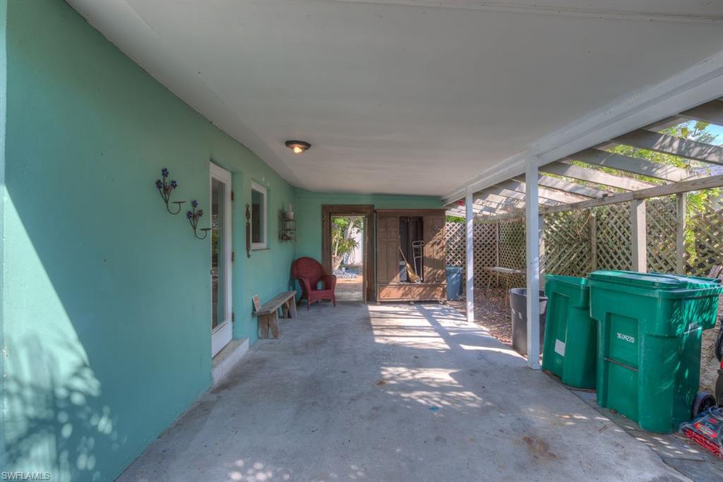 9144 7th Street North Naples, FL 34108 - Photo 20 of 20 a view of a porch with furniture and garden