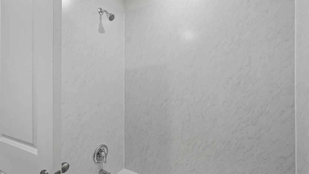 1627 Mantle Road Crandall, TX 75114 - Photo 26 of 40 Shower with white textured walls and chrome fixtures