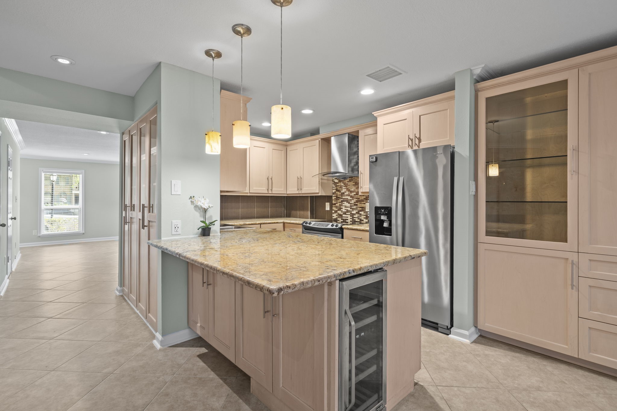 5801 Lumberdale Road, Unit 132 Houston, TX 77092 - Photo 1 of 33 Kitchen with stainless steel appliances, granite counters, and custom cabinetry.