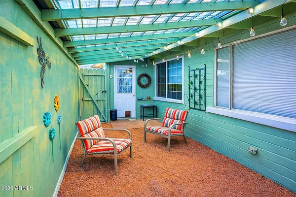a living room with furniture and a window
