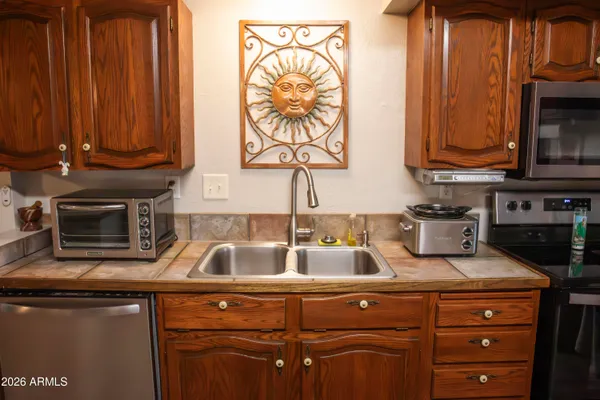 a bathroom with a toilet a sink and a mirror
