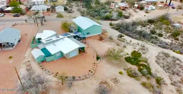 a kitchen with stainless steel appliances granite countertop a sink a stove and cabinets