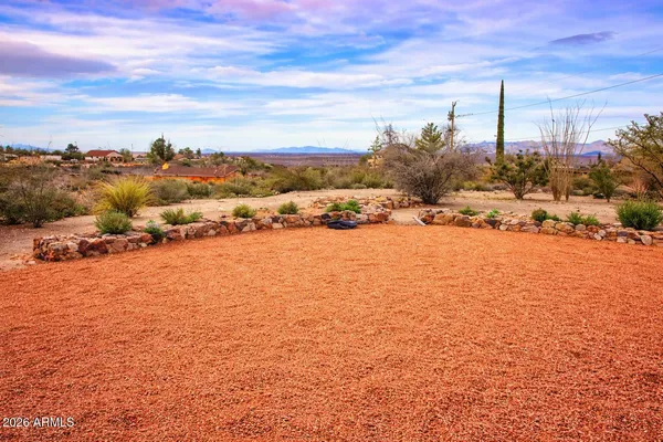 a kitchen with stainless steel appliances granite countertop a stove and a microwave