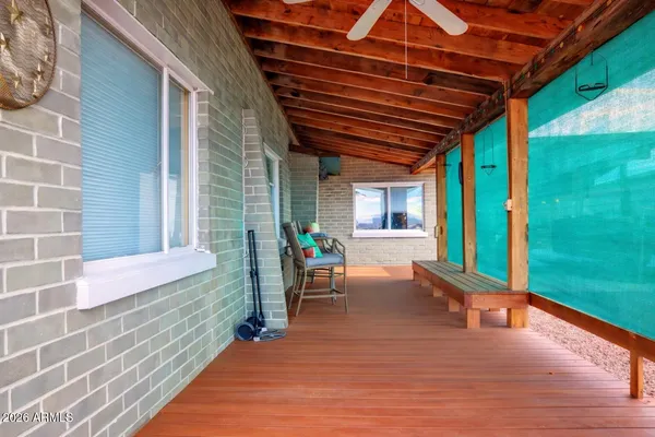 a bathroom with a shower a toilet and a window
