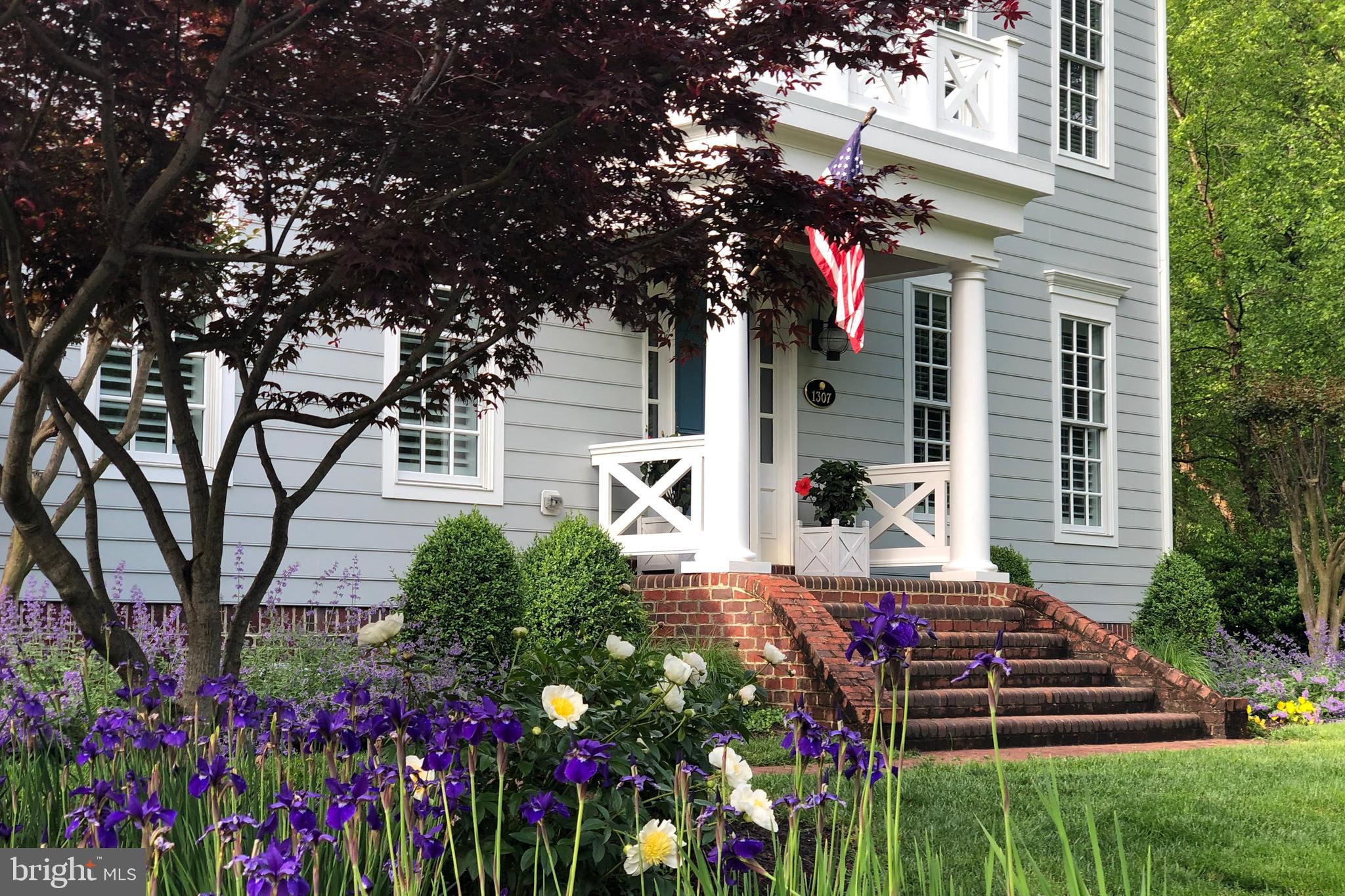 1307 Beachview Road Annapolis, MD 21403 - Photo 15 of 111 a front view of a house with a yard and fountain in middle of the house