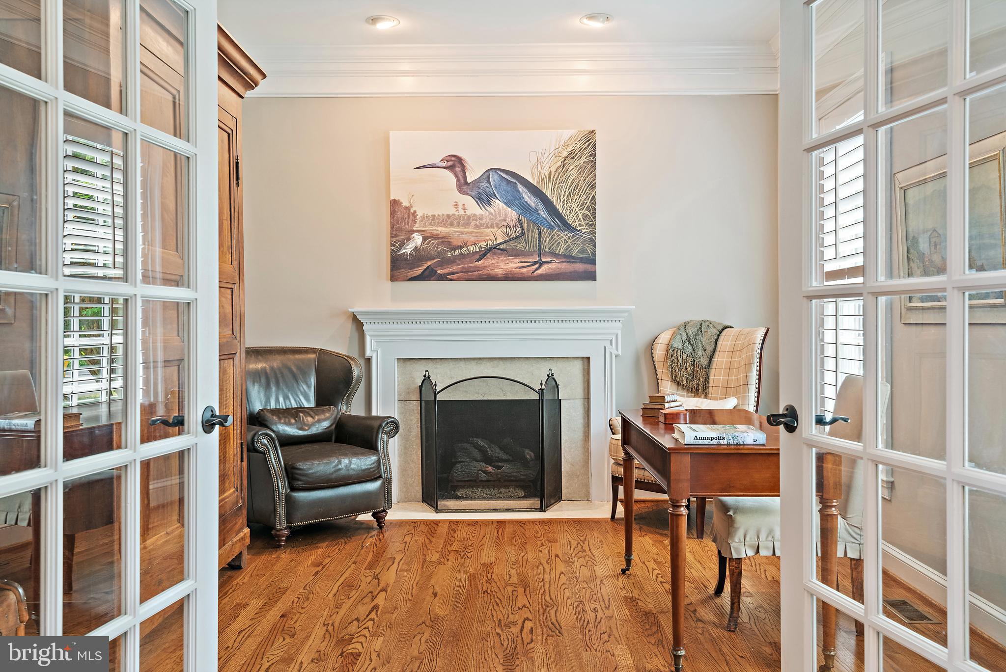 1307 Beachview Road Annapolis, MD 21403 - Photo 24 of 111 a living room with furniture a fireplace and a large window