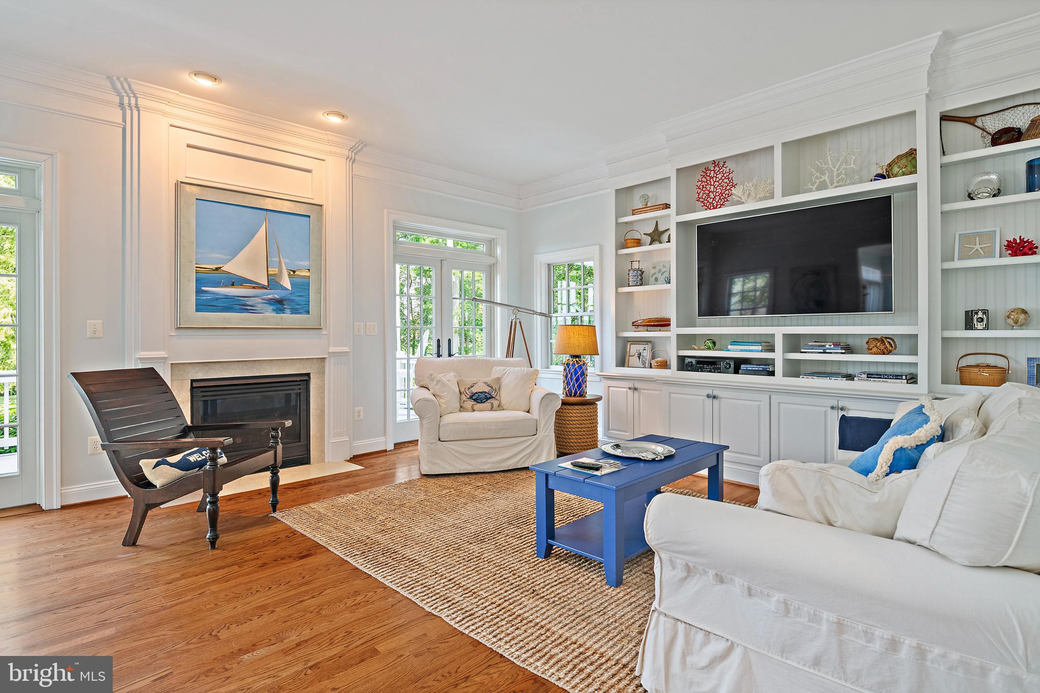 1307 Beachview Road Annapolis, MD 21403 - Photo 27 of 111 a living room with furniture and a flat screen tv