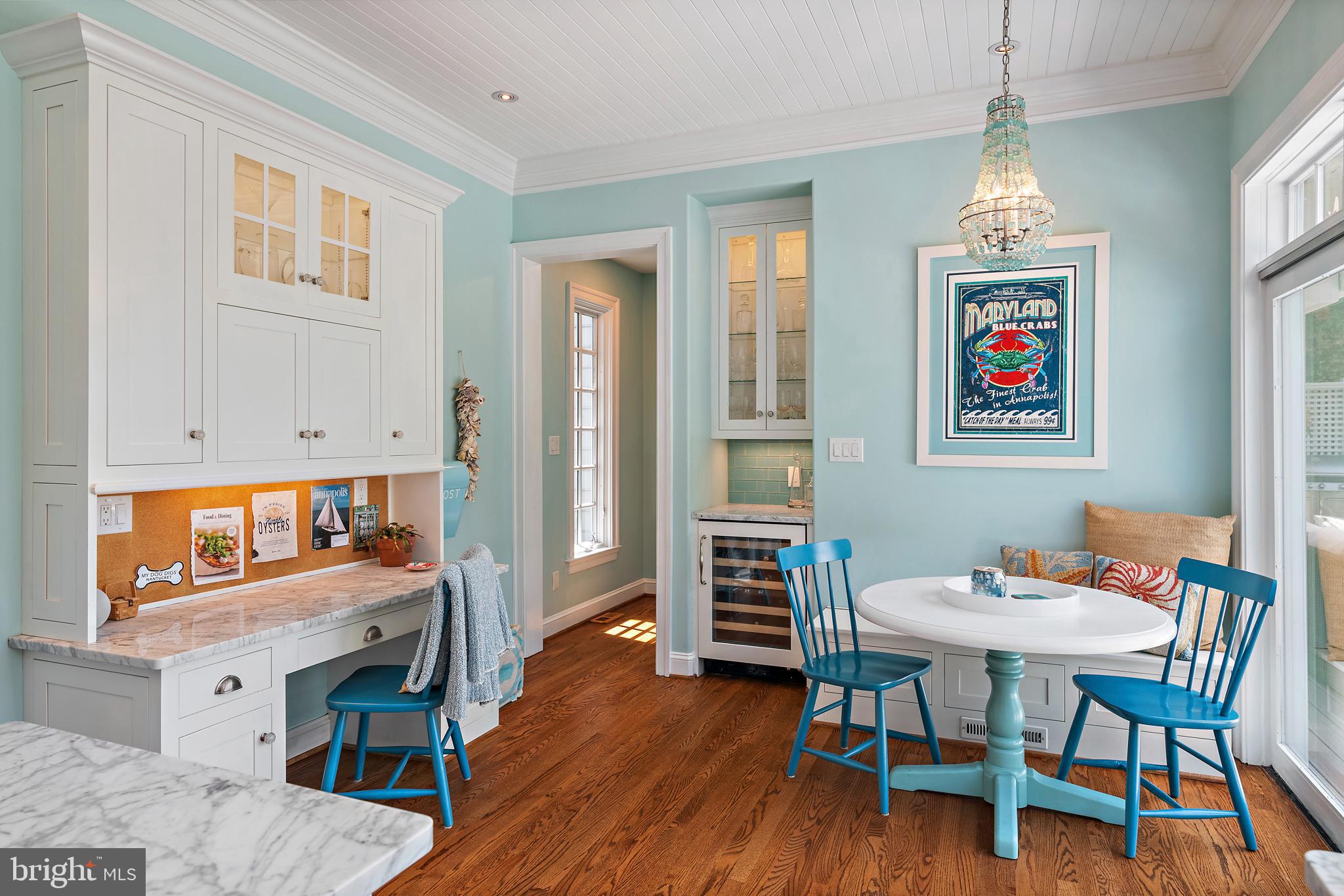 1307 Beachview Road Annapolis, MD 21403 - Photo 37 of 111 a view of a dining room with furniture wooden floor and a chandelier