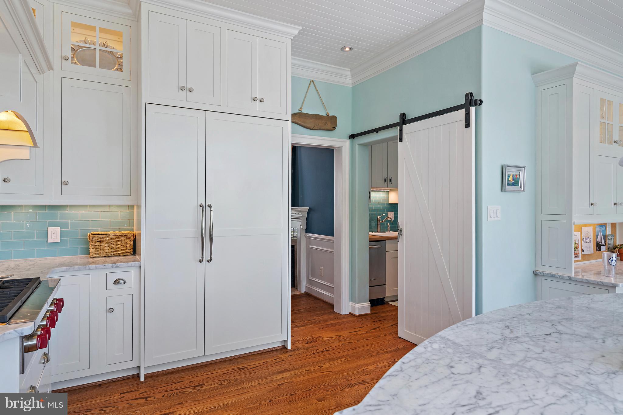 1307 Beachview Road Annapolis, MD 21403 - Photo 40 of 111 a view of hallway with wooden floor and cabinet