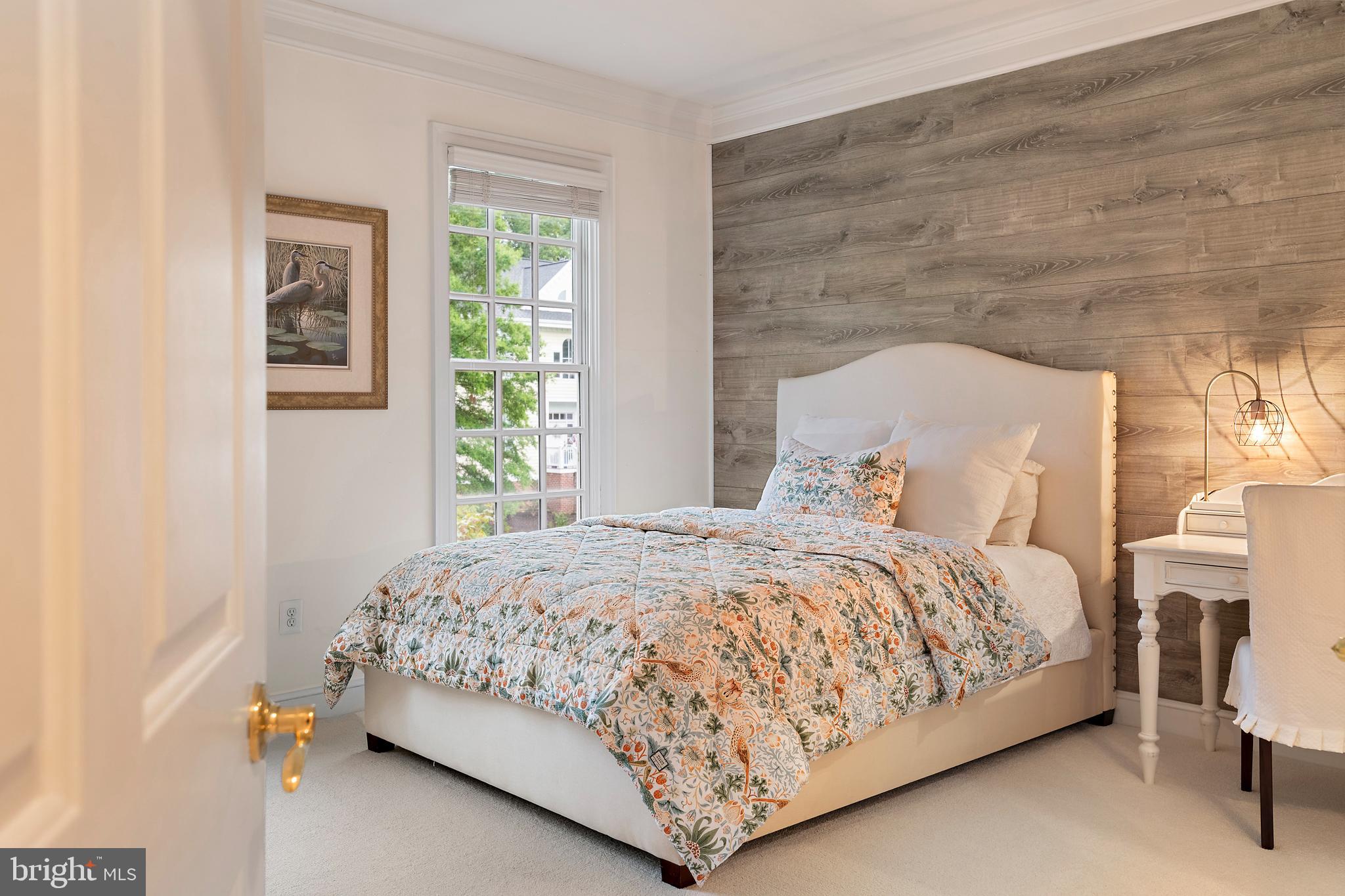 1307 Beachview Road Annapolis, MD 21403 - Photo 68 of 111 a bedroom with a bed lamp and a window