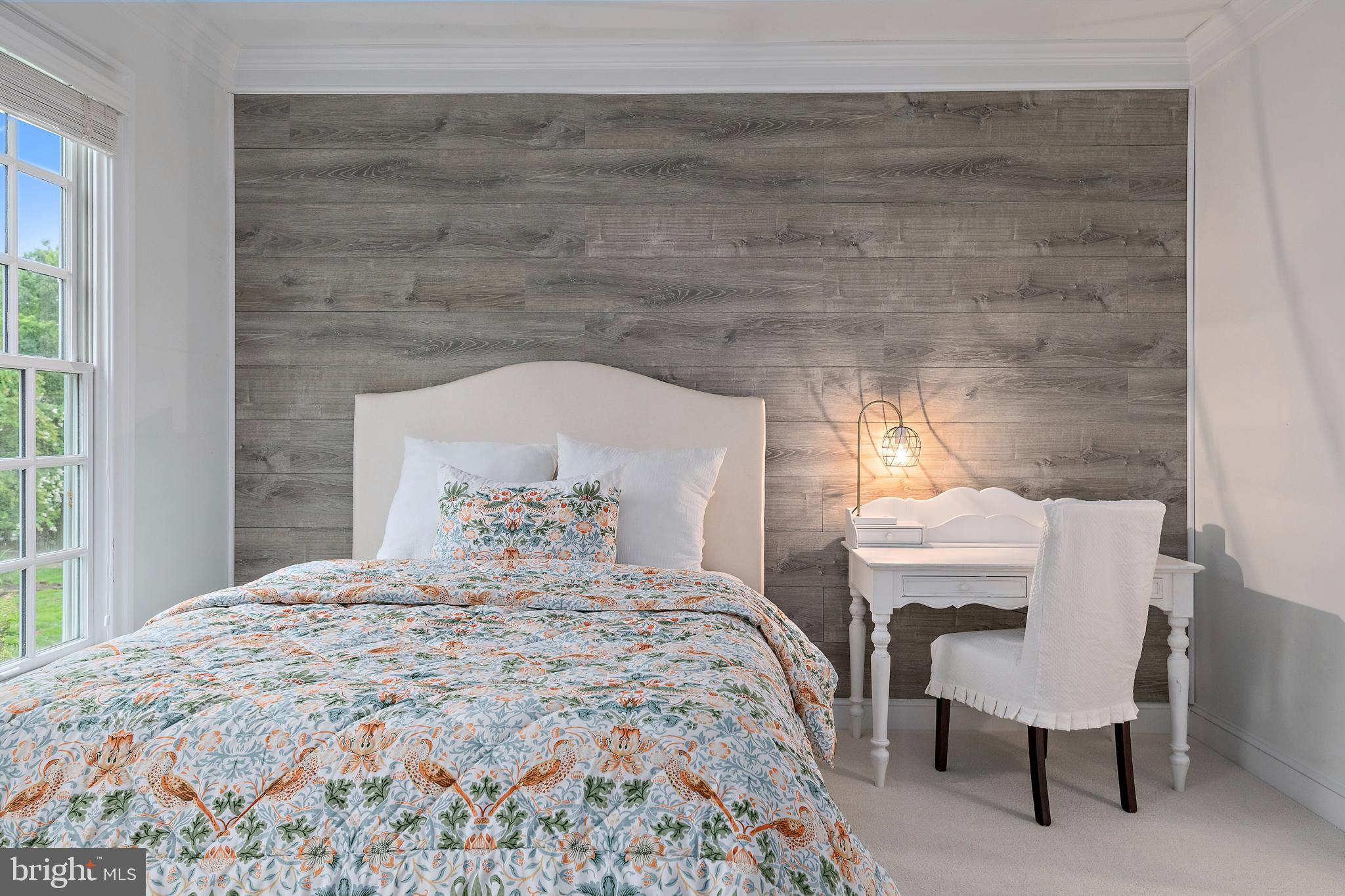 1307 Beachview Road Annapolis, MD 21403 - Photo 69 of 111 a bedroom with a bed and a chair