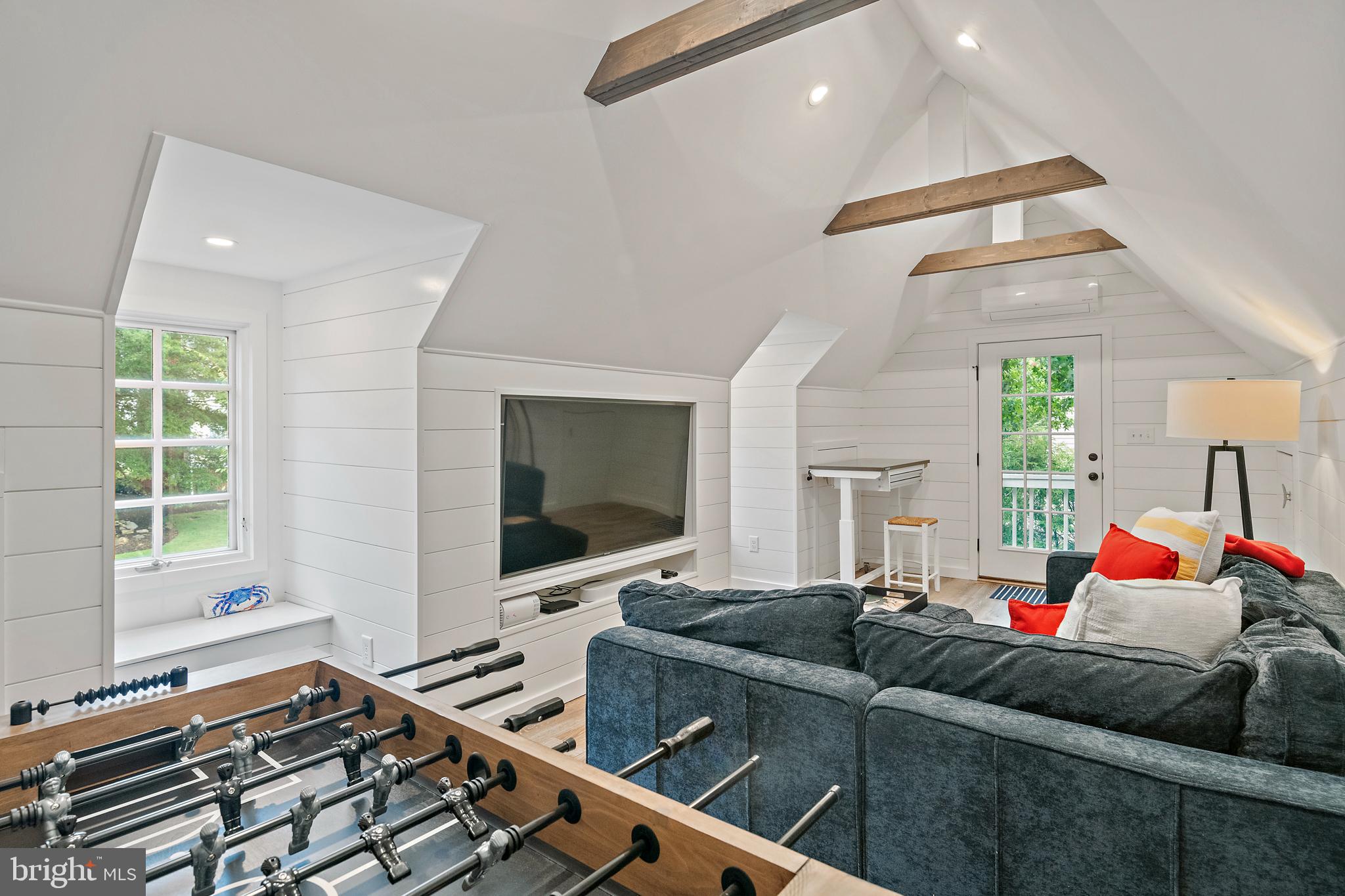 1307 Beachview Road Annapolis, MD 21403 - Photo 75 of 111 a living room with furniture and a flat screen tv