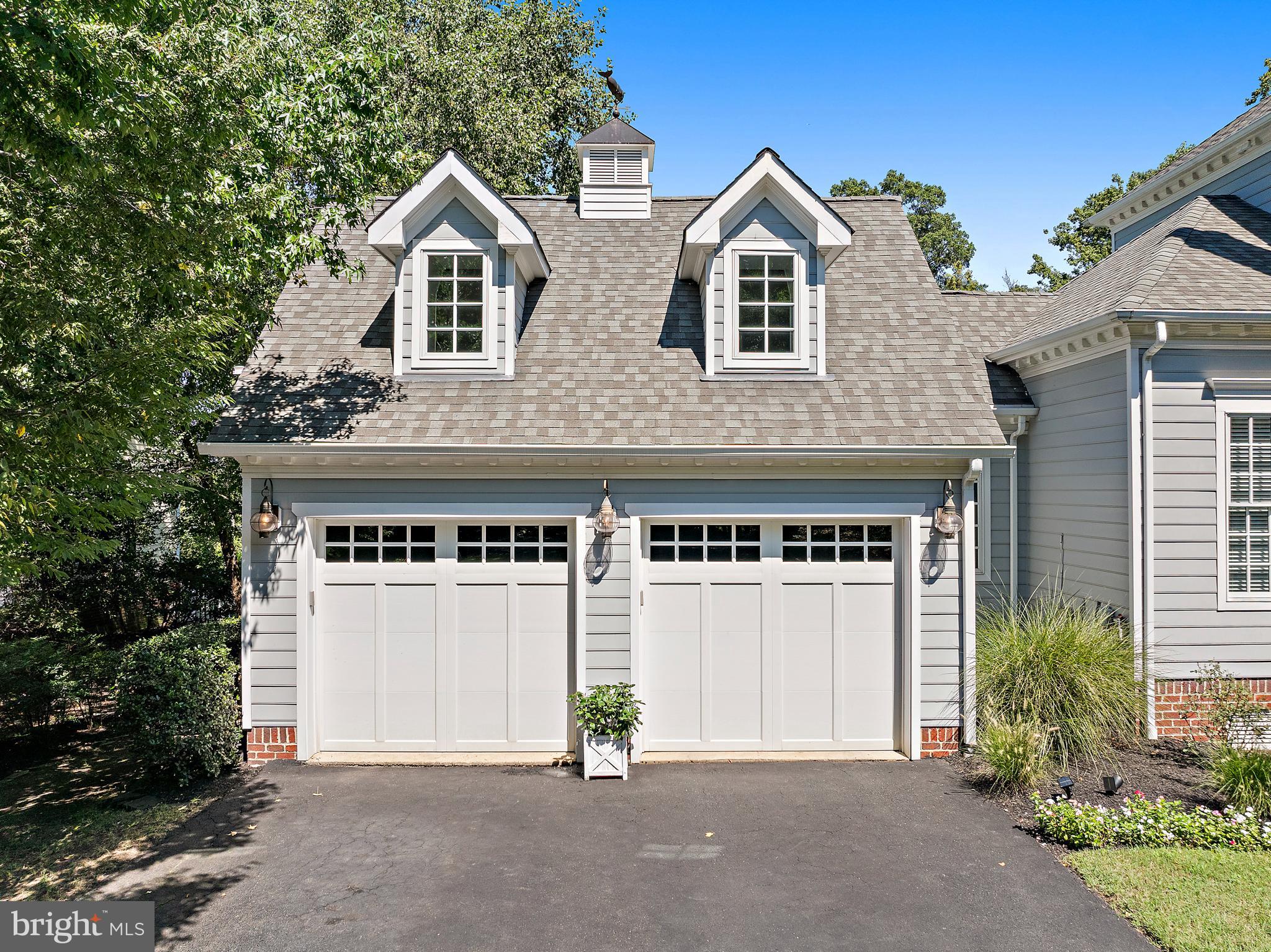 1307 Beachview Road Annapolis, MD 21403 - Photo 99 of 111 a front view of a house with a yard and garage